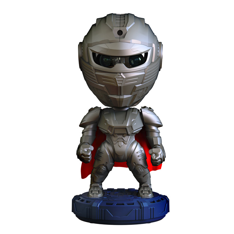 Toy figure of a robot with a helmet and red cape on a white background