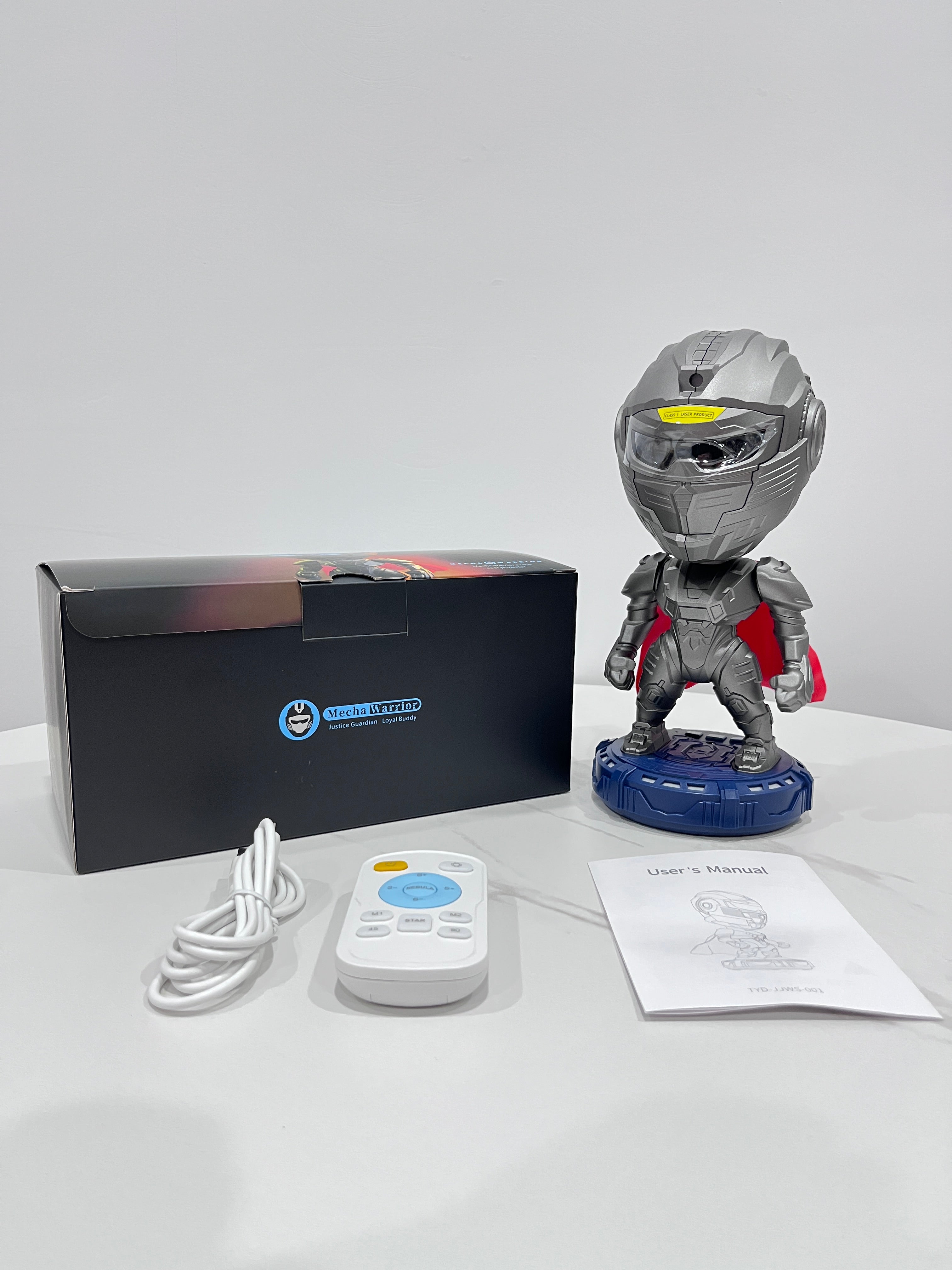 Motorcycle helmet bobblehead with packaging, helmet, and accessories on a white surface.