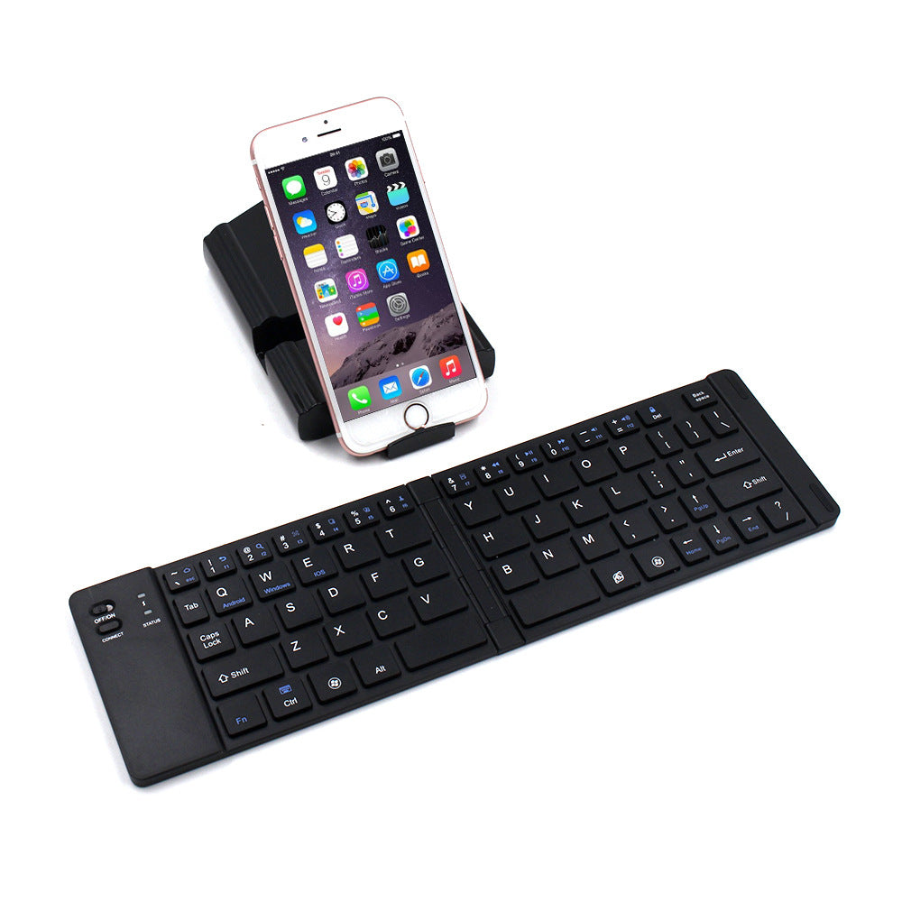 Black keyboard with smartphone on a white background